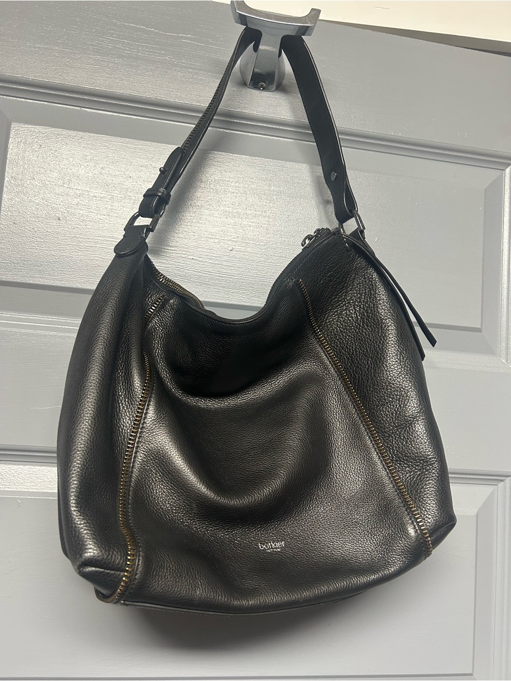 Botkier Soho or Trigger hobo style black pebbled leather shoulder bag. Zippers